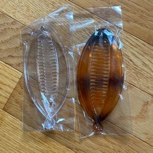 …one is clear and other is black/brown…..NEVER worn in original packing